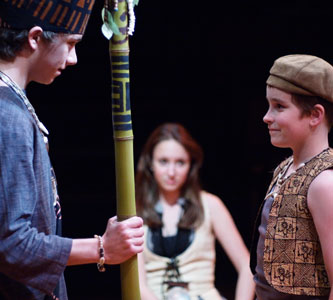 Tavana Nui (Willie Casper) meets his son Mafatu (Sam Pearson), as Kana (Rachel Ravel) looks on.